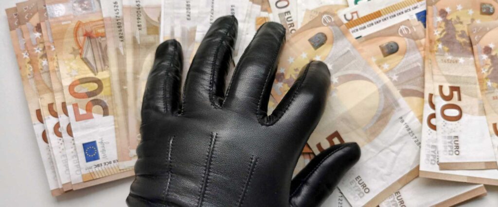 A sinister gloved hand reaching for a pile of Euros. ItalianLaw.net legal experts can help clients outside of Italy to discover any misrepresentations or othe irregularities in inheritance cases and insurance claims made in Italy.